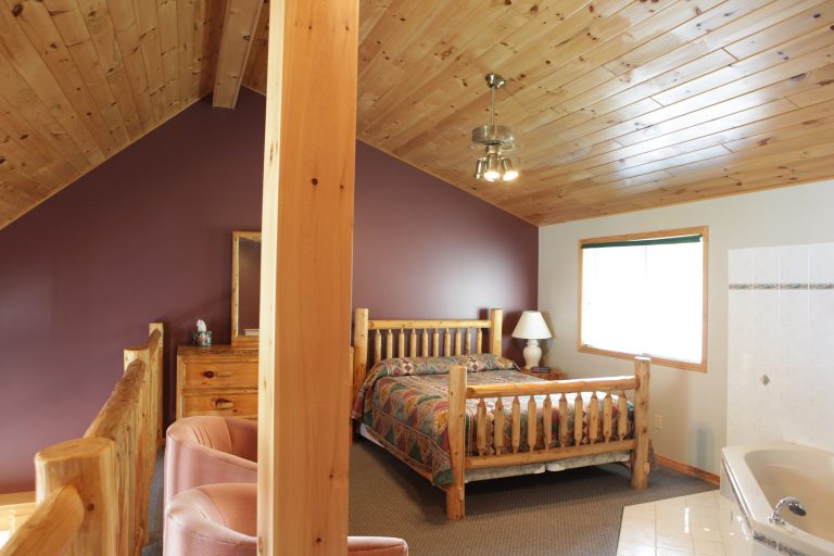 woodsy-bedroom-with-log-style-furniture