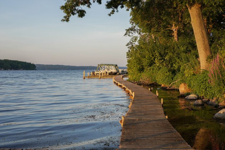 View down a long boardwalk along the lakeside